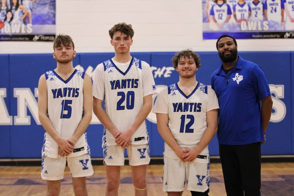 3 basketball players with coach