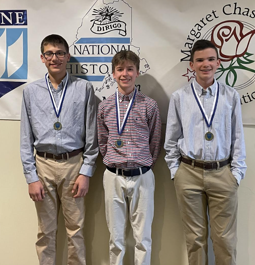 Three boys with medals