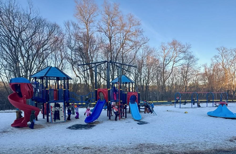 students playing on a wintry playground