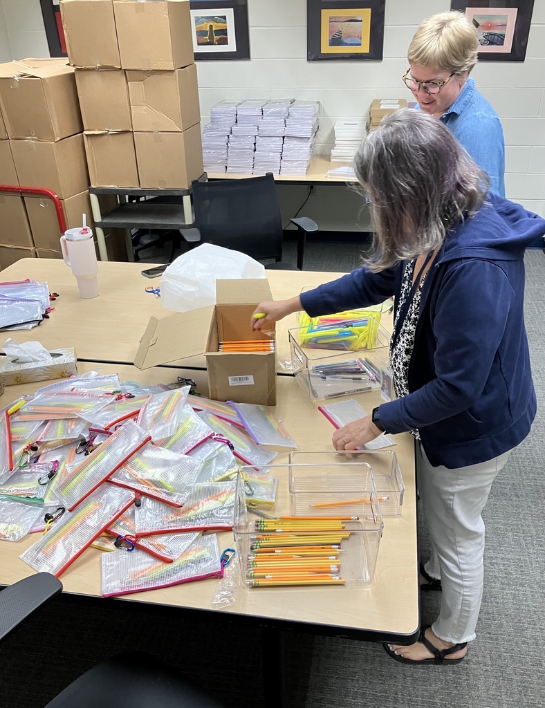 Ms. Van Dzura and Ms. Buerhaus are getting students' school supplies ready