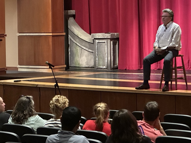 Speaker stage talking to audience members