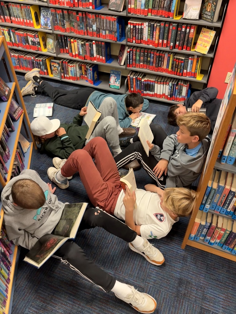 7th grade students from Ms. Hill's class, reading in the HMS library