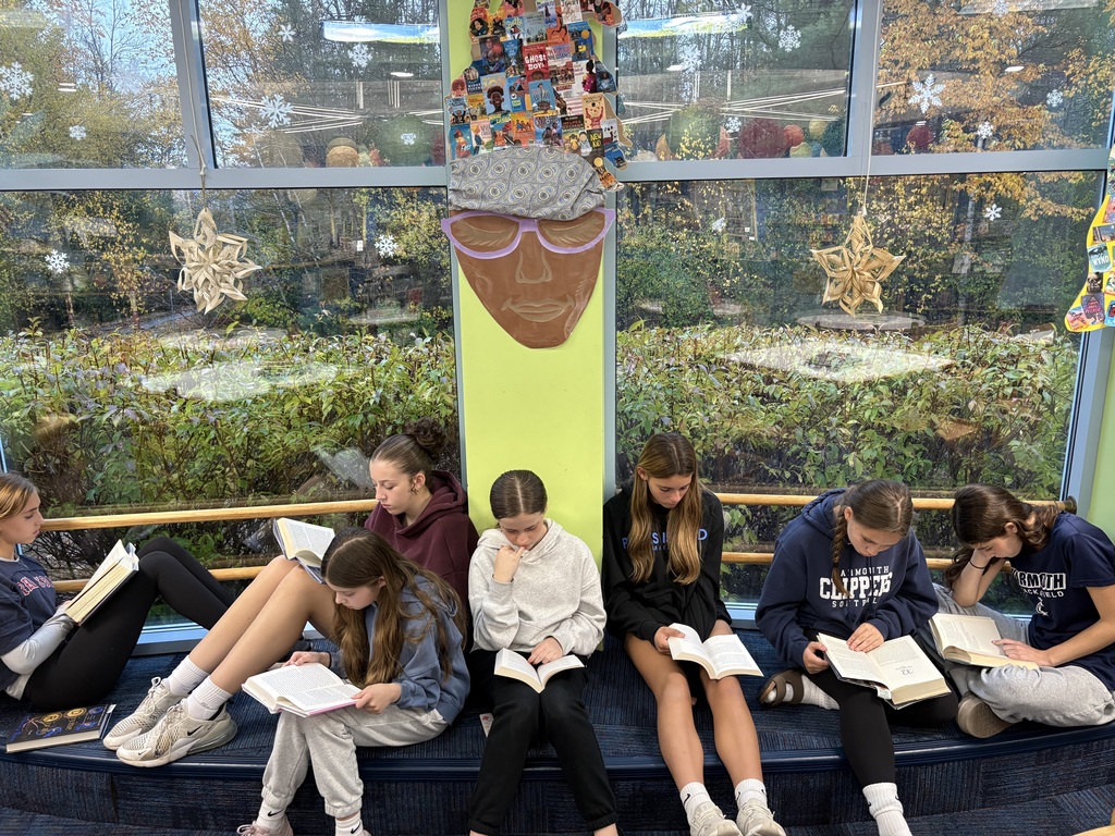 7th-grade Language Arts students reading in the library