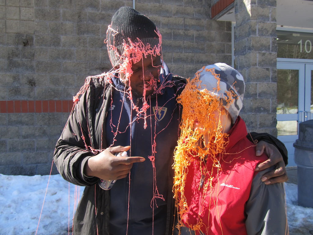 Staff member and student after a silly string battle