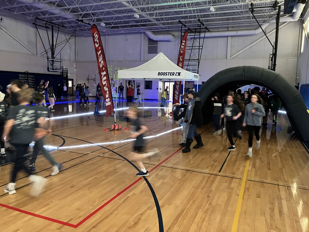 6th graders participating in the Glow Run fundraiser for the PTO