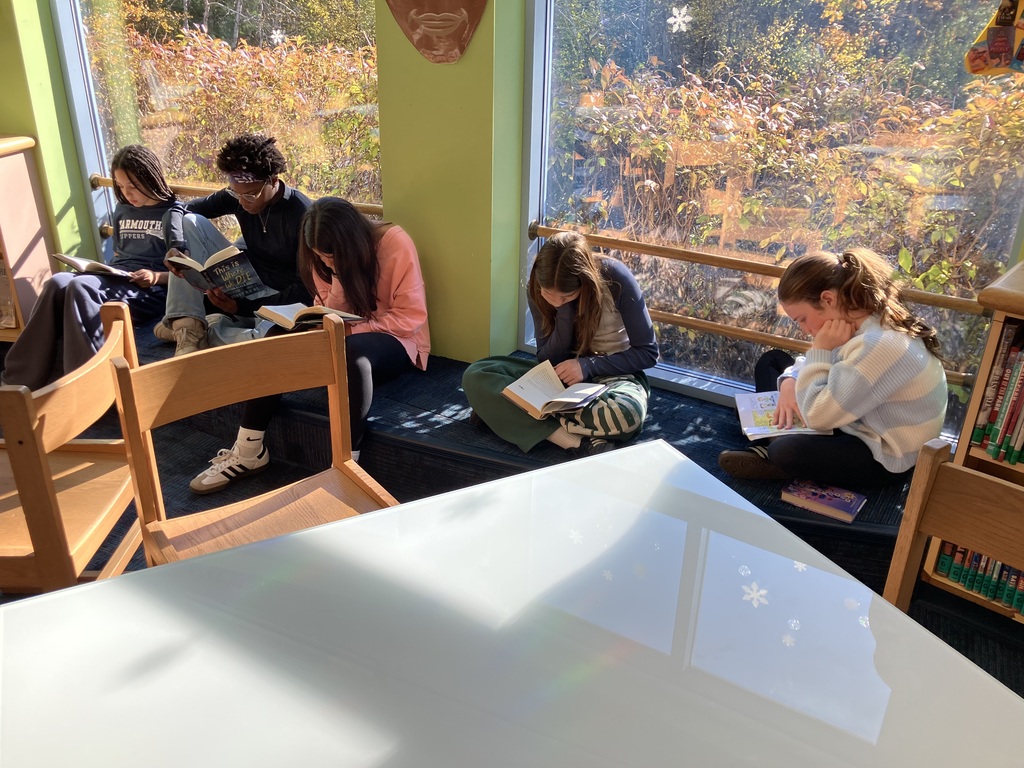 7th graders reading in our library during Language Arts class
