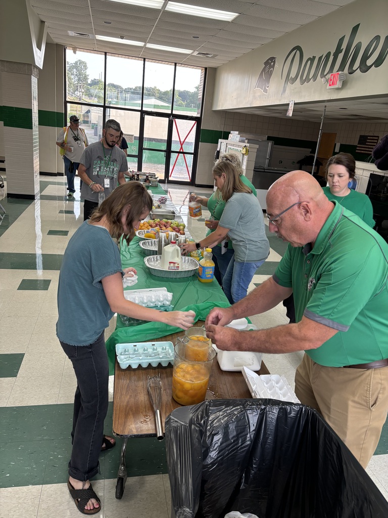 staff helping with breakfast