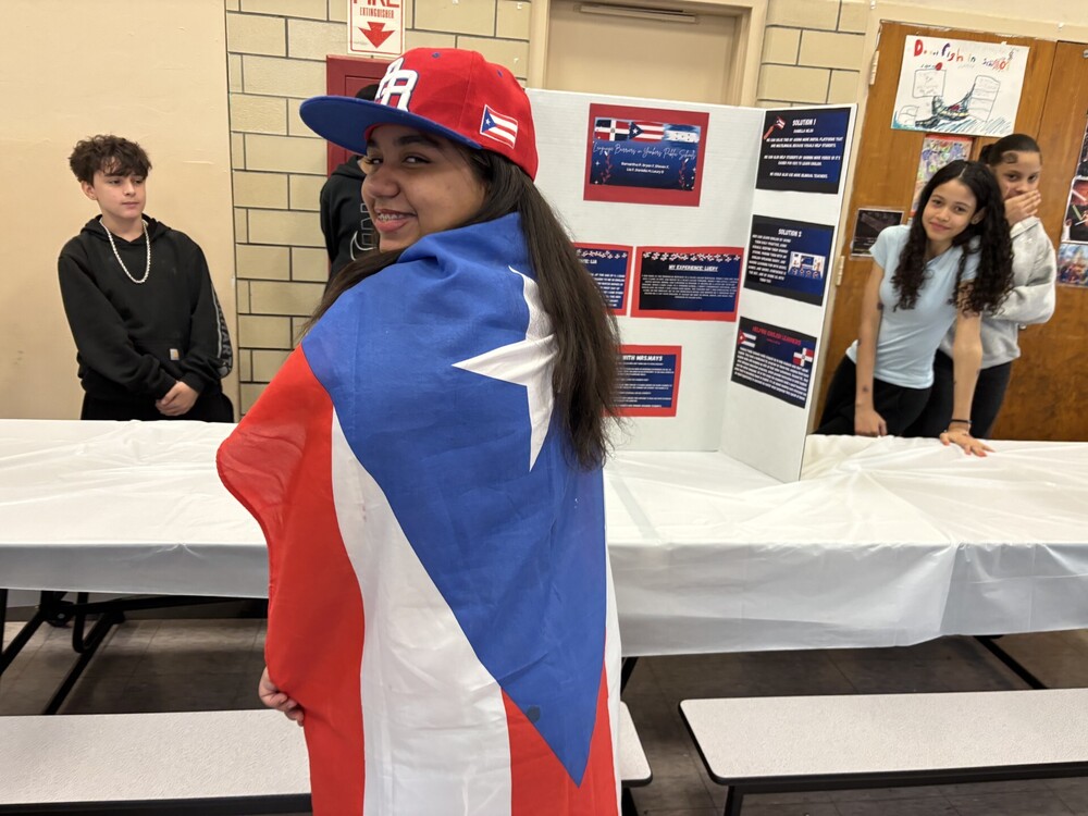 Student draped in flag