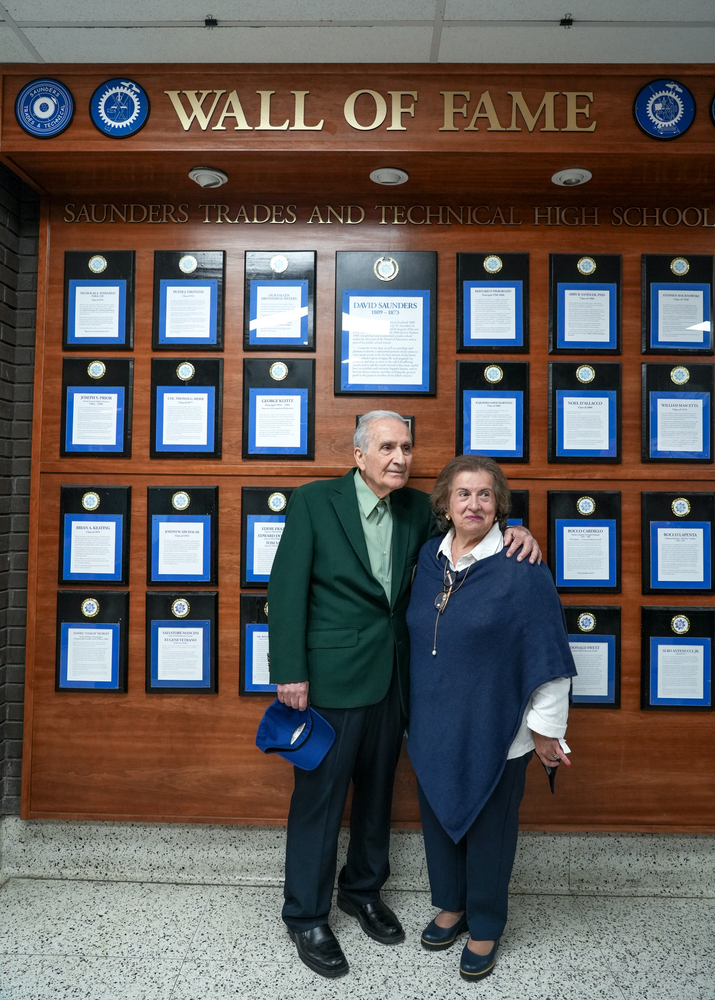 Salvatore Corrente and BOE President Dr. Rosalba Corrado Del Vecchio in front of Saunders Wall of Fame