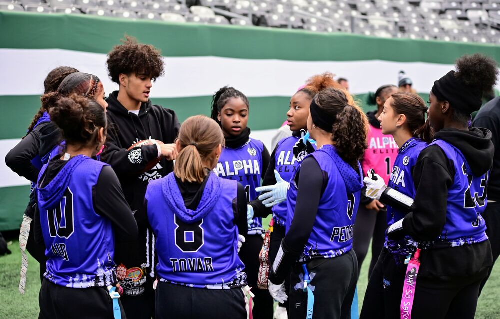 Omar Areche coaching Girls Flag Football