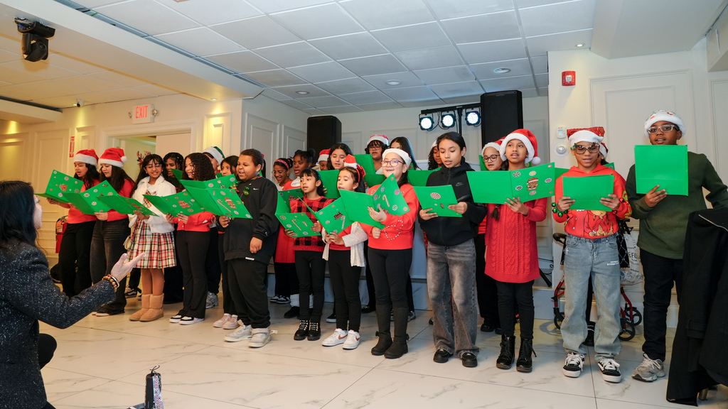  At the top of the month, the Enrico Fermi School choir sang in full Christmas spirit at the Office of the Aging Senior Citizens Holiday Party! 