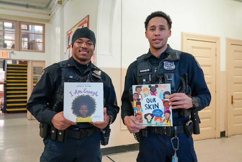 two police officers with books
