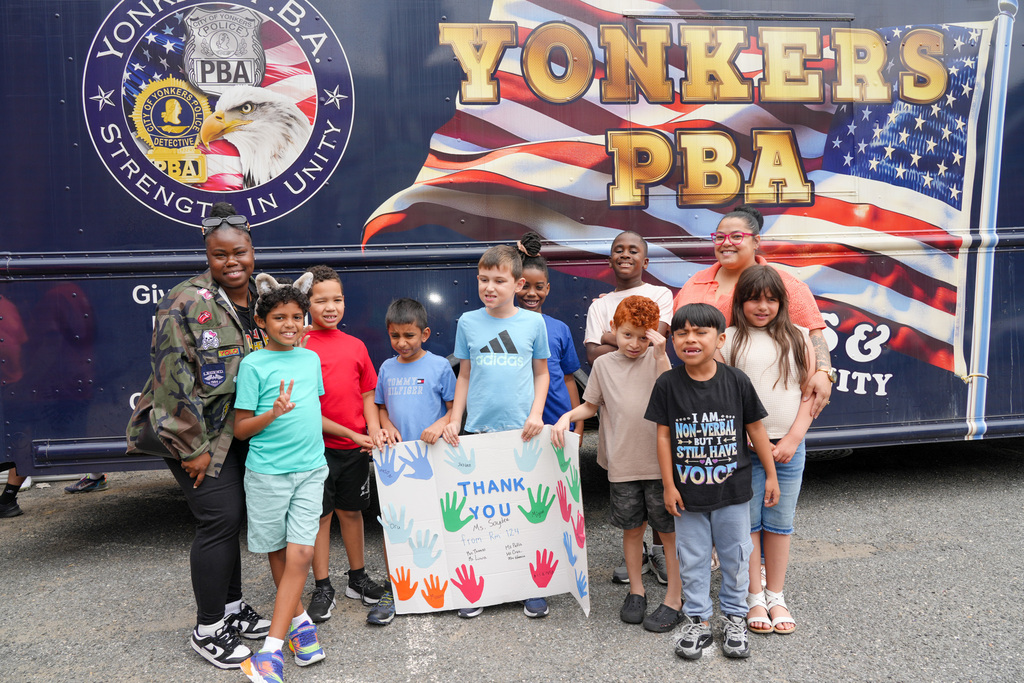 Today, the Yonkers Police Benevolent Association (PBA) returned to Yonkers Montessori Academy to host its annual BBQ for the Extended School Year (ESY) program, treating students and staff to a delicious lunch of burgers and hot dogs.