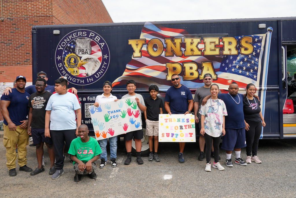 Today, the Yonkers Police Benevolent Association (PBA) returned to Yonkers Montessori Academy to host its annual BBQ for the Extended School Year (ESY) program, treating students and staff to a delicious lunch of burgers and hot dogs.