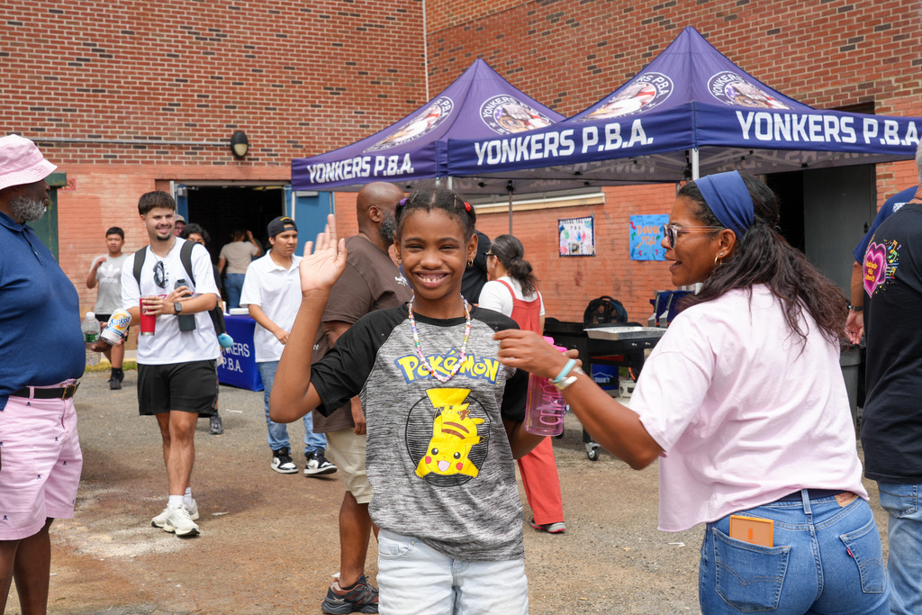 Today, the Yonkers Police Benevolent Association (PBA) returned to Yonkers Montessori Academy to host its annual BBQ for the Extended School Year (ESY) program, treating students and staff to a delicious lunch of burgers and hot dogs.