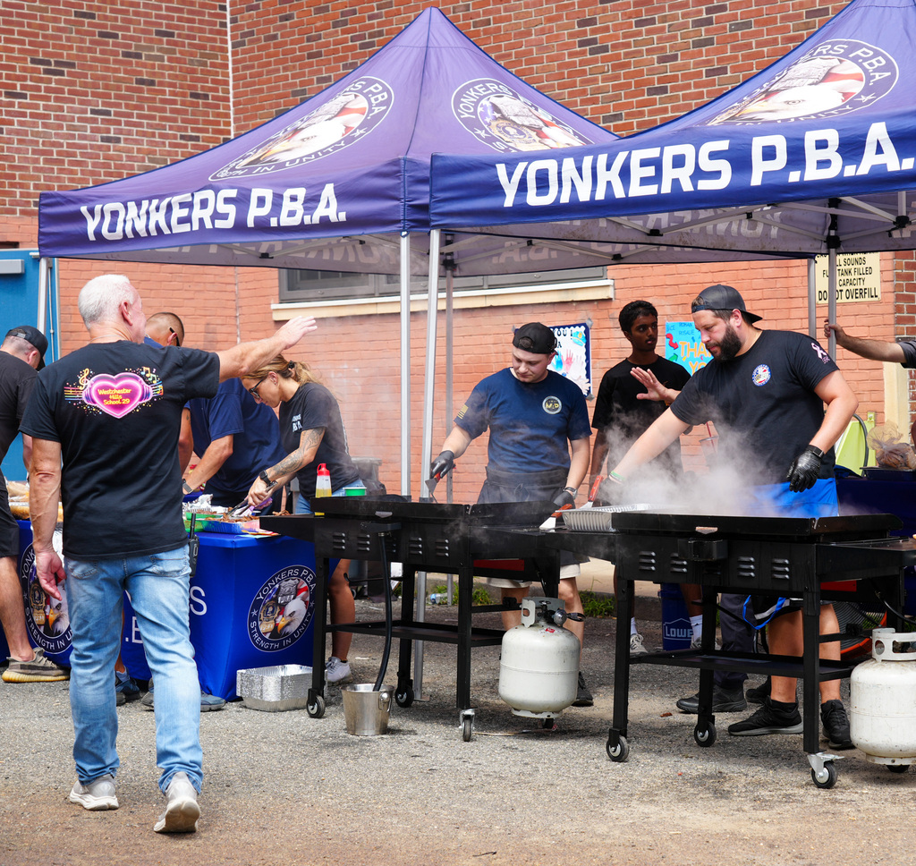 Today, the Yonkers Police Benevolent Association (PBA) returned to Yonkers Montessori Academy to host its annual BBQ for the Extended School Year (ESY) program, treating students and staff to a delicious lunch of burgers and hot dogs.
