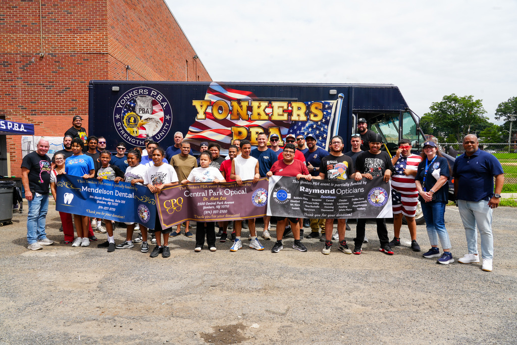 Today, the Yonkers Police Benevolent Association (PBA) returned to Yonkers Montessori Academy to host its annual BBQ for the Extended School Year (ESY) program, treating students and staff to a delicious lunch of burgers and hot dogs.
