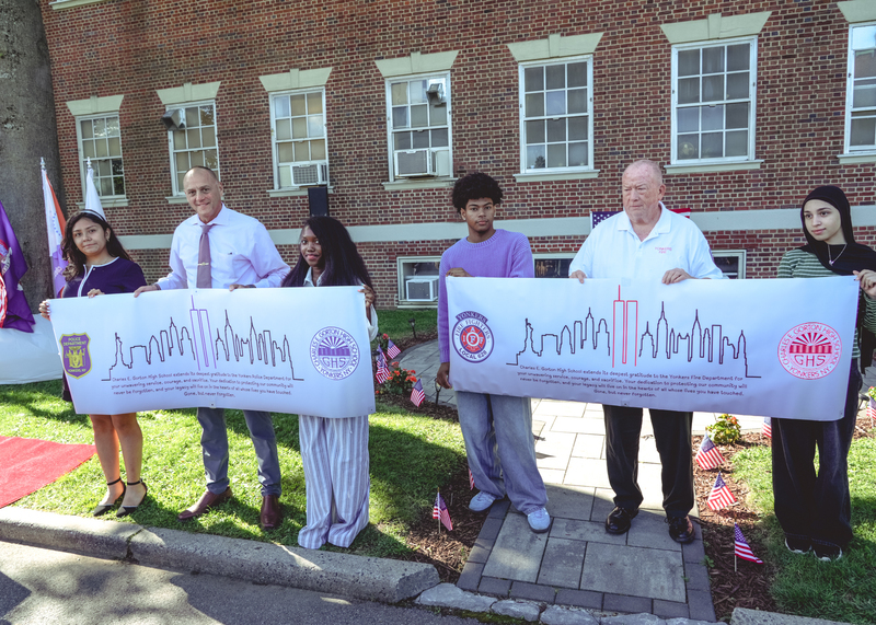 Students present banners of appreciation to Fire and Police officials