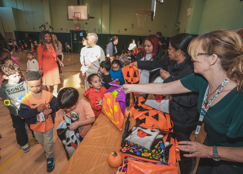 Costumes being handed out to students