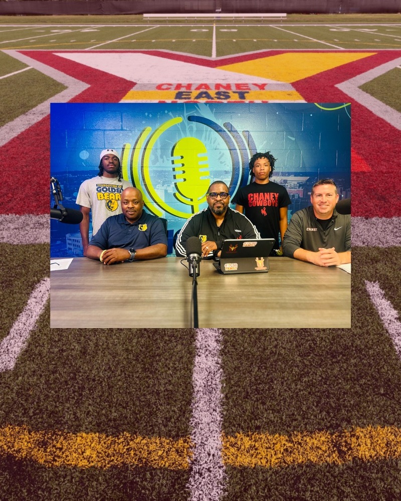 group photo of two males coaches and two male  players