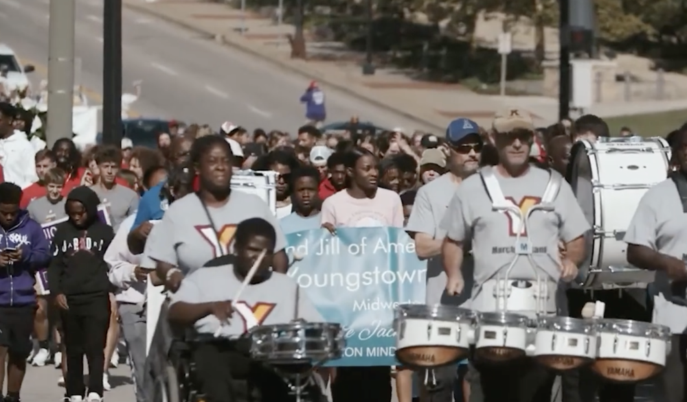 crowd participating in a parade