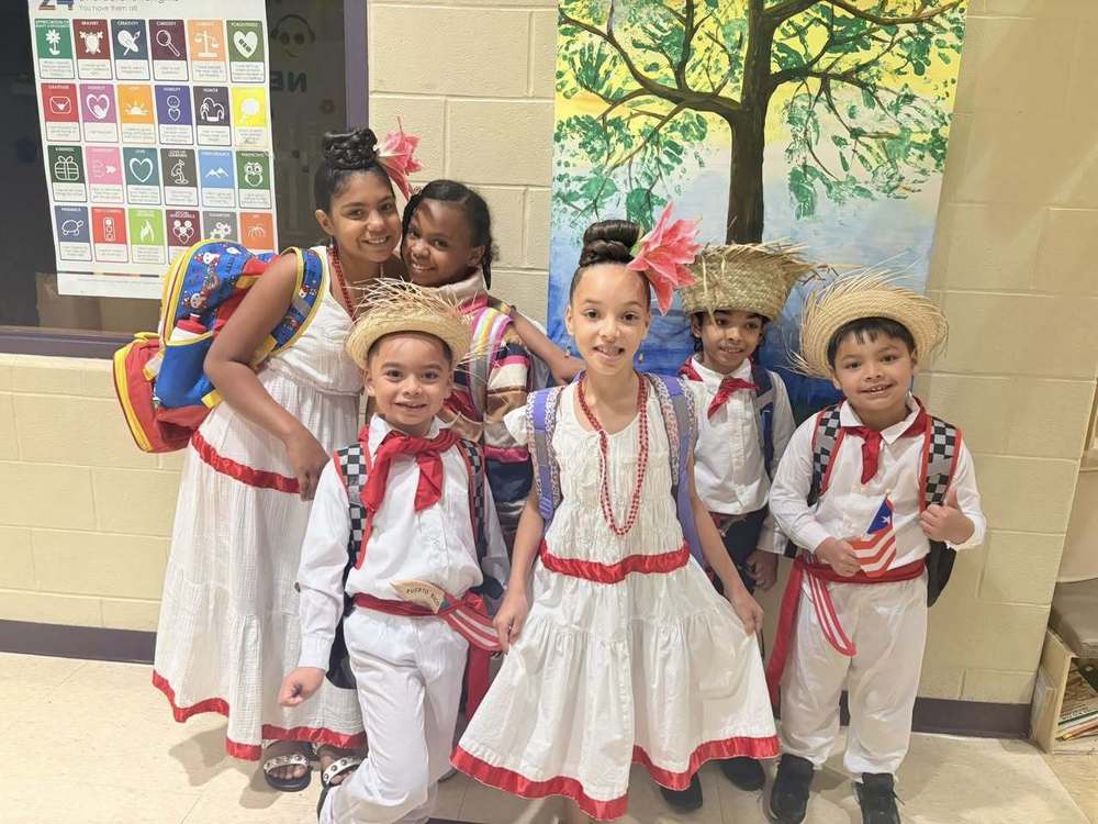group of children in hispanic cultural attire