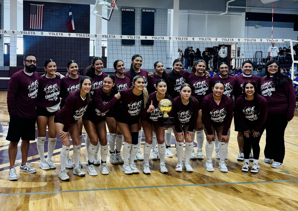 Image of volleball team holding a trophy