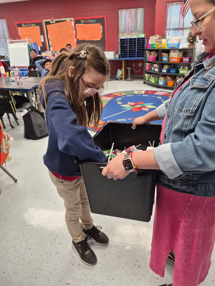 4th grader trying to decide what to choose from the Treasure Chest for being on time to school