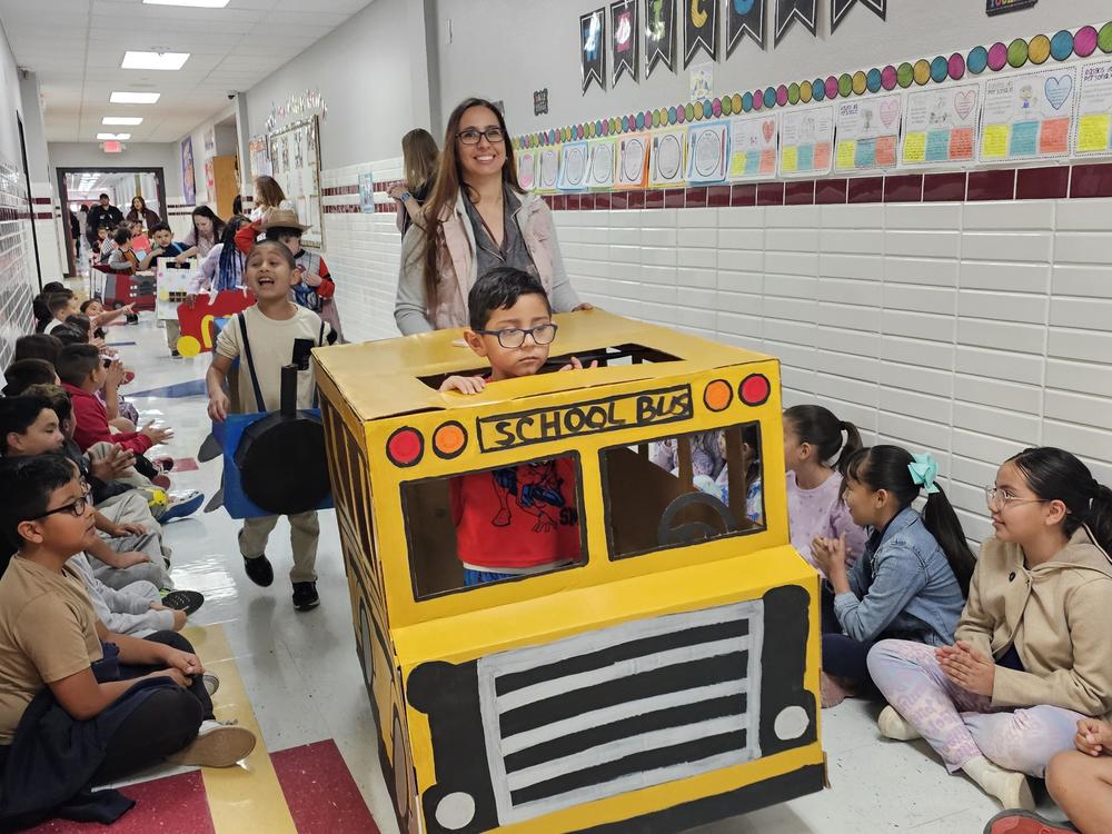Pk Bus in the Transportation parade 2026 walking down the 3rd grade hall