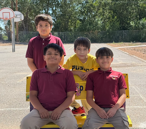 Students pose with Friendship Bench