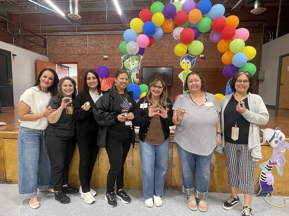 Teachers received their years of service pins.