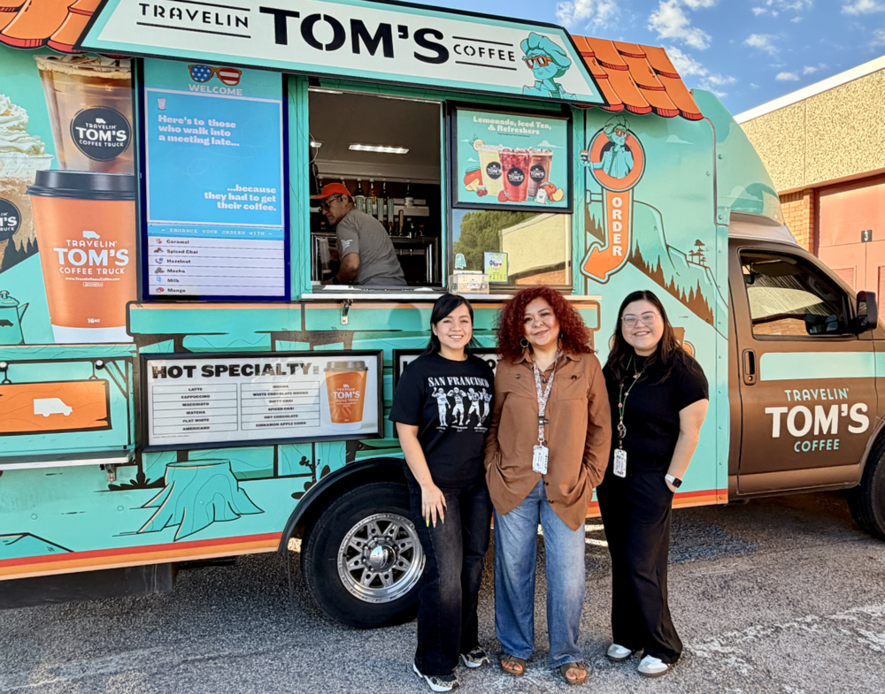 Teachers pose in front of Tom's Coffee Truck