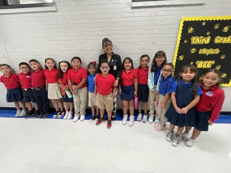 principal taking a picture with students