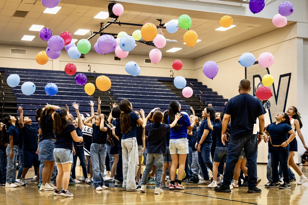 Aztecs celebrating thier end of their routine at PE Showcase.