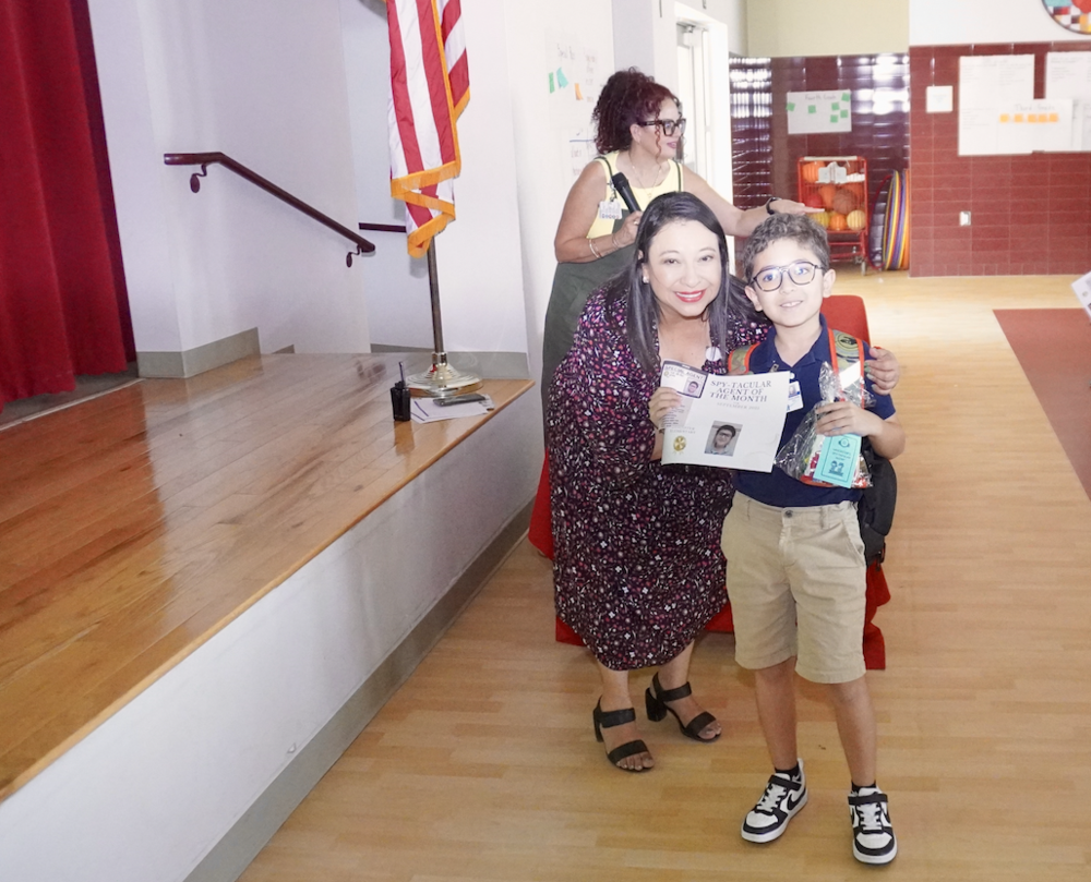 Aztec student being awarded for student of the month.