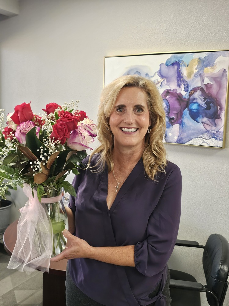 Principal Banegas with bouquet of red, white and white with pink roses