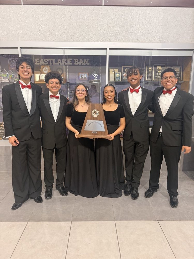 Senior Choir Students holding award