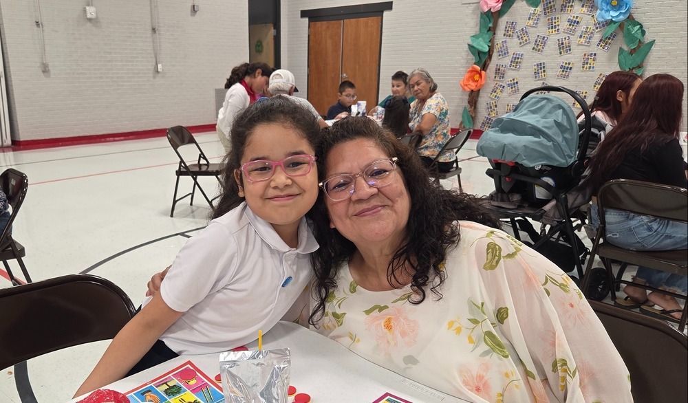 3rd grader and her Grandma pose for a photo