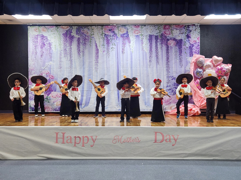 Ms. Guerrero's students playing mariachi instruments