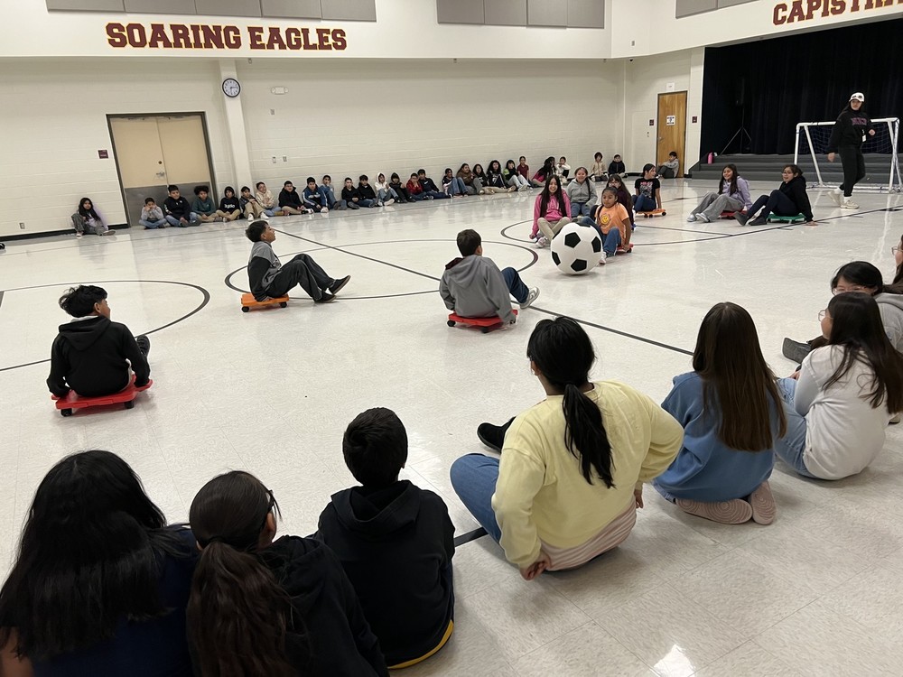 students sitting on a scooter 