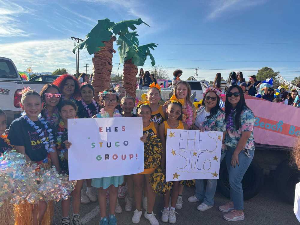 students and teachers at homecoming parade