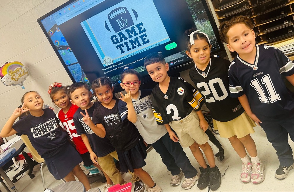 Our little Wildcats pose with their jerseys