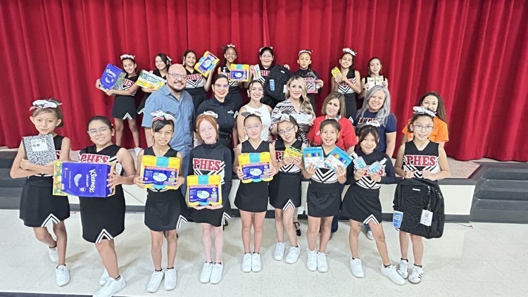 posing with school supplies