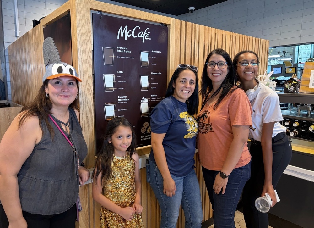 a group of 5 people (teachers and students) posing at Mcdonalds 
