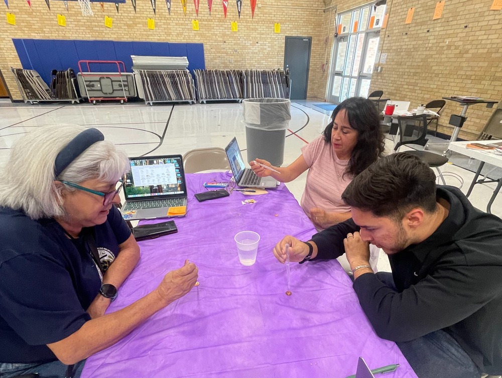 Teachers doing a science experiment.