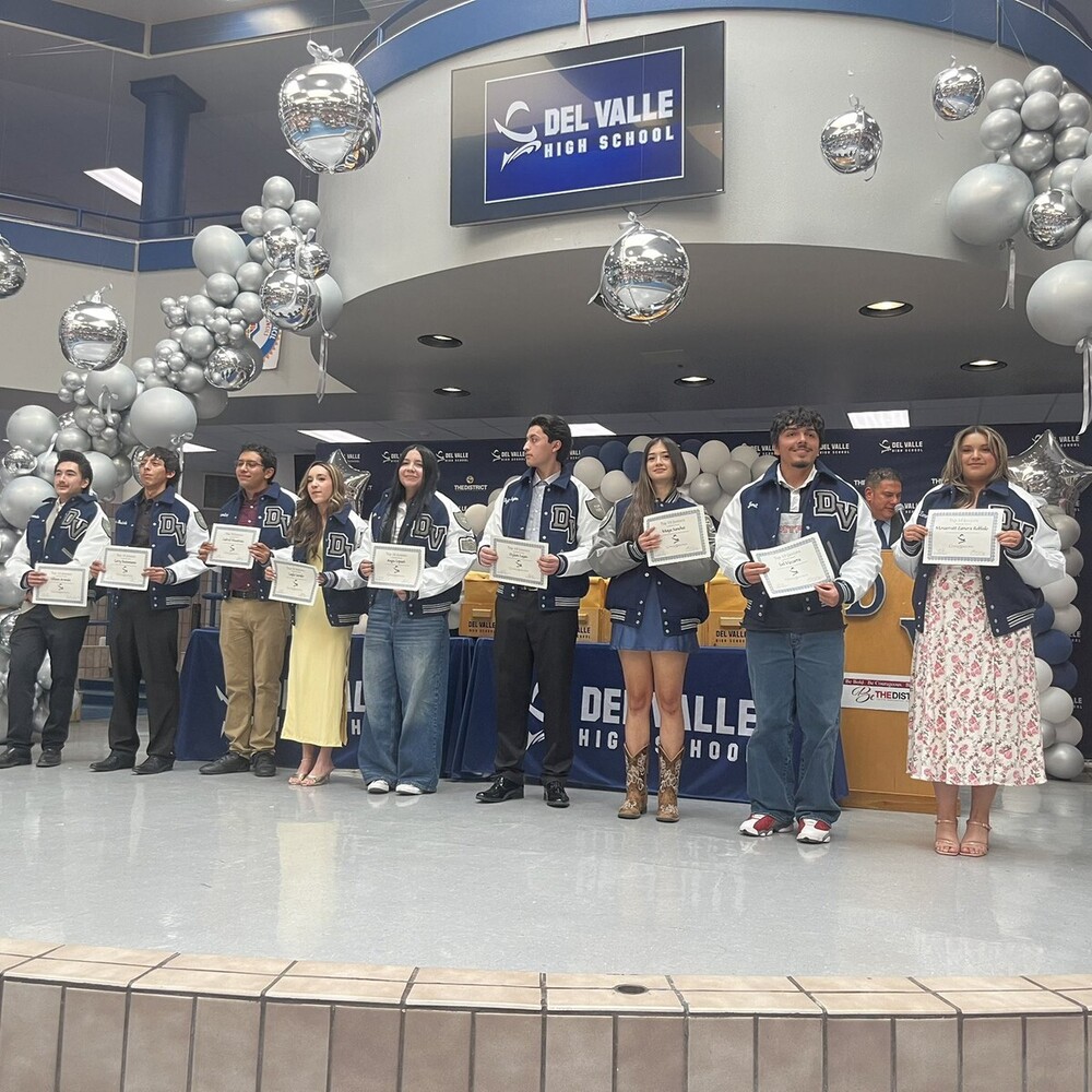 Awards ceremony students display their certificate in DVHS commons