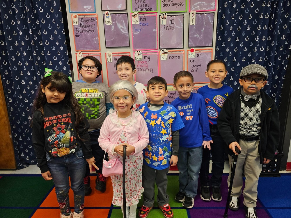 1st graders dress up for the 100th day of school in t-shirts and like older people