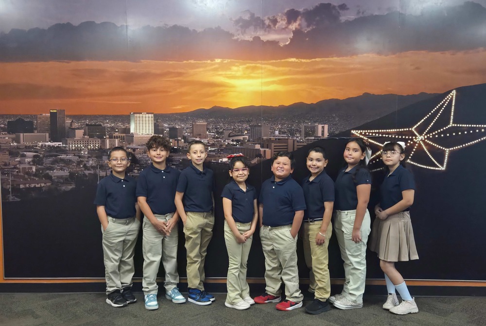 Presa Students pose in front of  El Paso City Backdrop with Star on the Mountain on the right