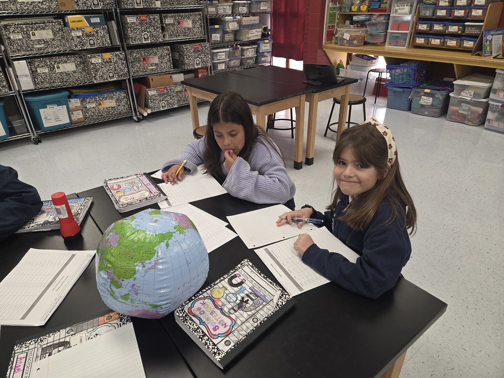 4th grade students work on recording data onto a table