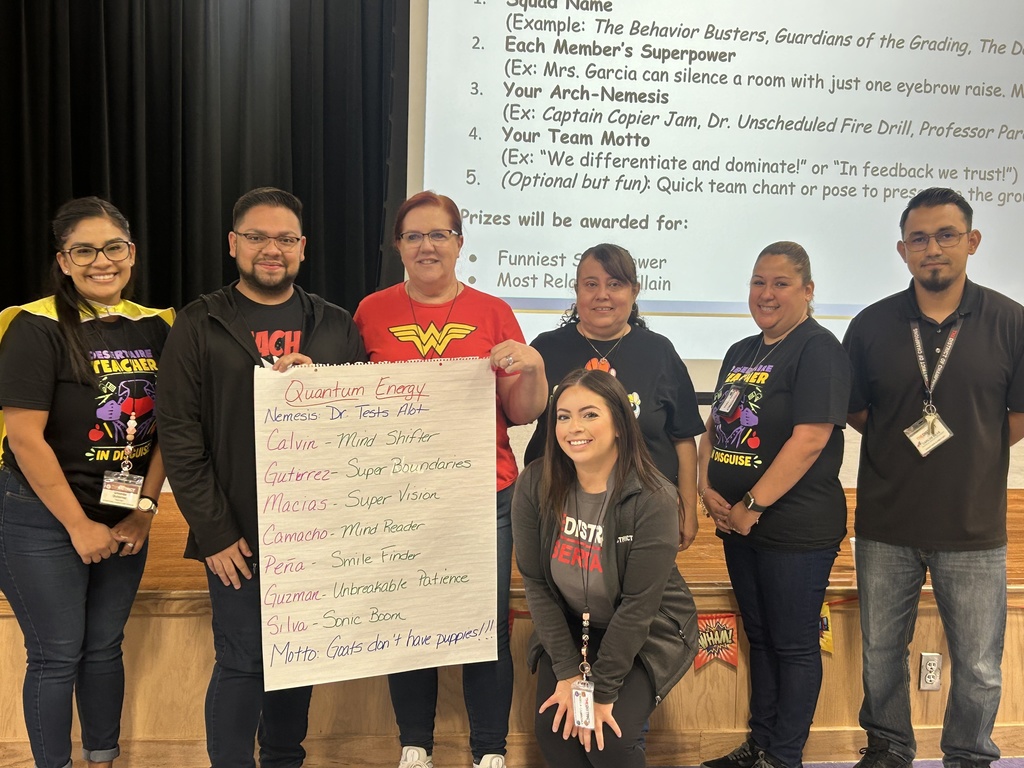 Fifth Grade teachers holding Super Power Poster